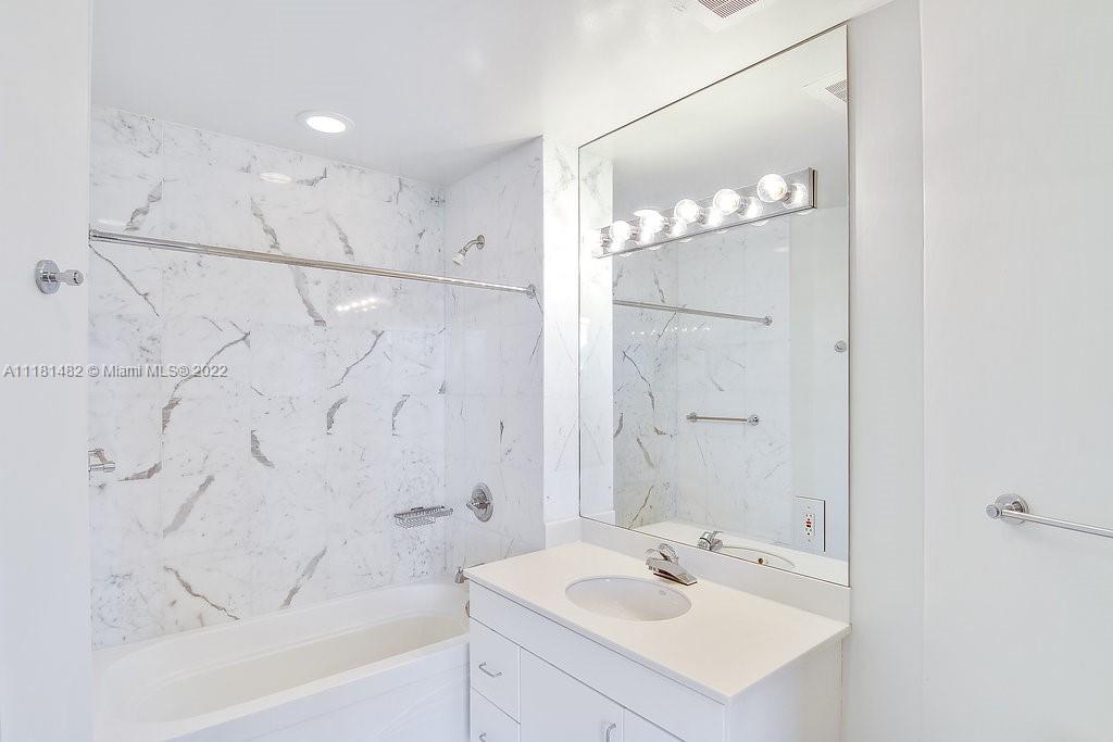 1500 Bay Road, Unit C2312 Miami Beach, FL 33139 - Photo 15 of 20 a bathroom with a sink vanity tub and shower