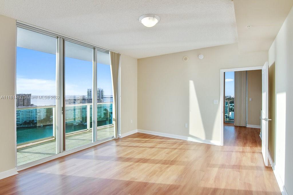1500 Bay Road, Unit C2312 Miami Beach, FL 33139 - Photo 17 of 20 a view of an empty room with glass door