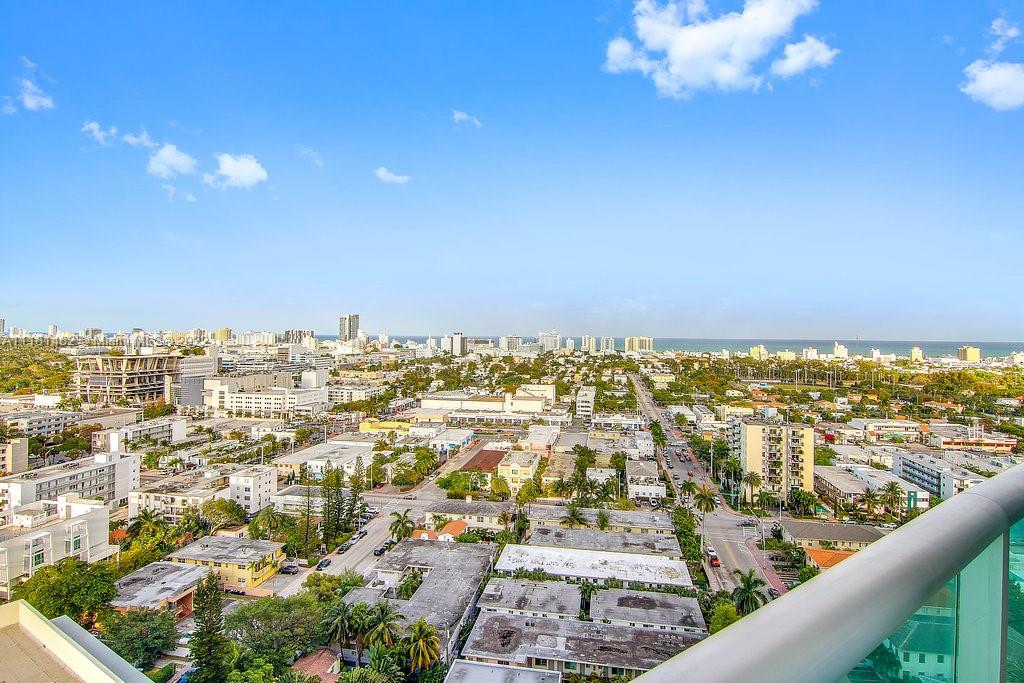 1500 Bay Road, Unit C2312 Miami Beach, FL 33139 - Photo 10 of 20 an aerial view of residential building and ocean view in back