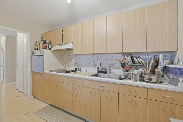 a kitchen with a sink and cabinets