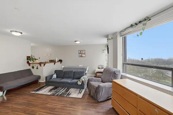 a living room with furniture and a large window