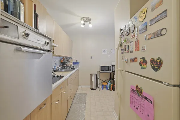 a kitchen with a refrigerator and a sink