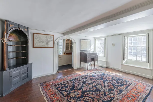 a living room with furniture and a rug