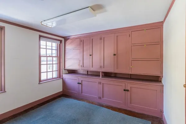 a kitchen with granite countertop cabinets stainless steel appliances a sink and wooden floor
