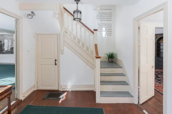 a view of entryway with wooden floor and stairs