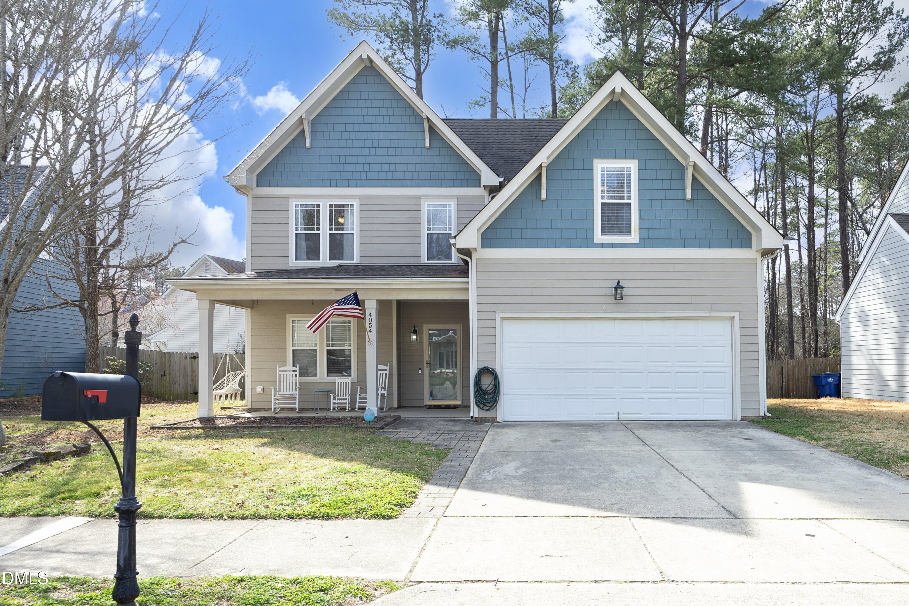 4054 Landover Lane Raleigh, NC 27616 - Photo 1 of 27 a front view of a house with garden