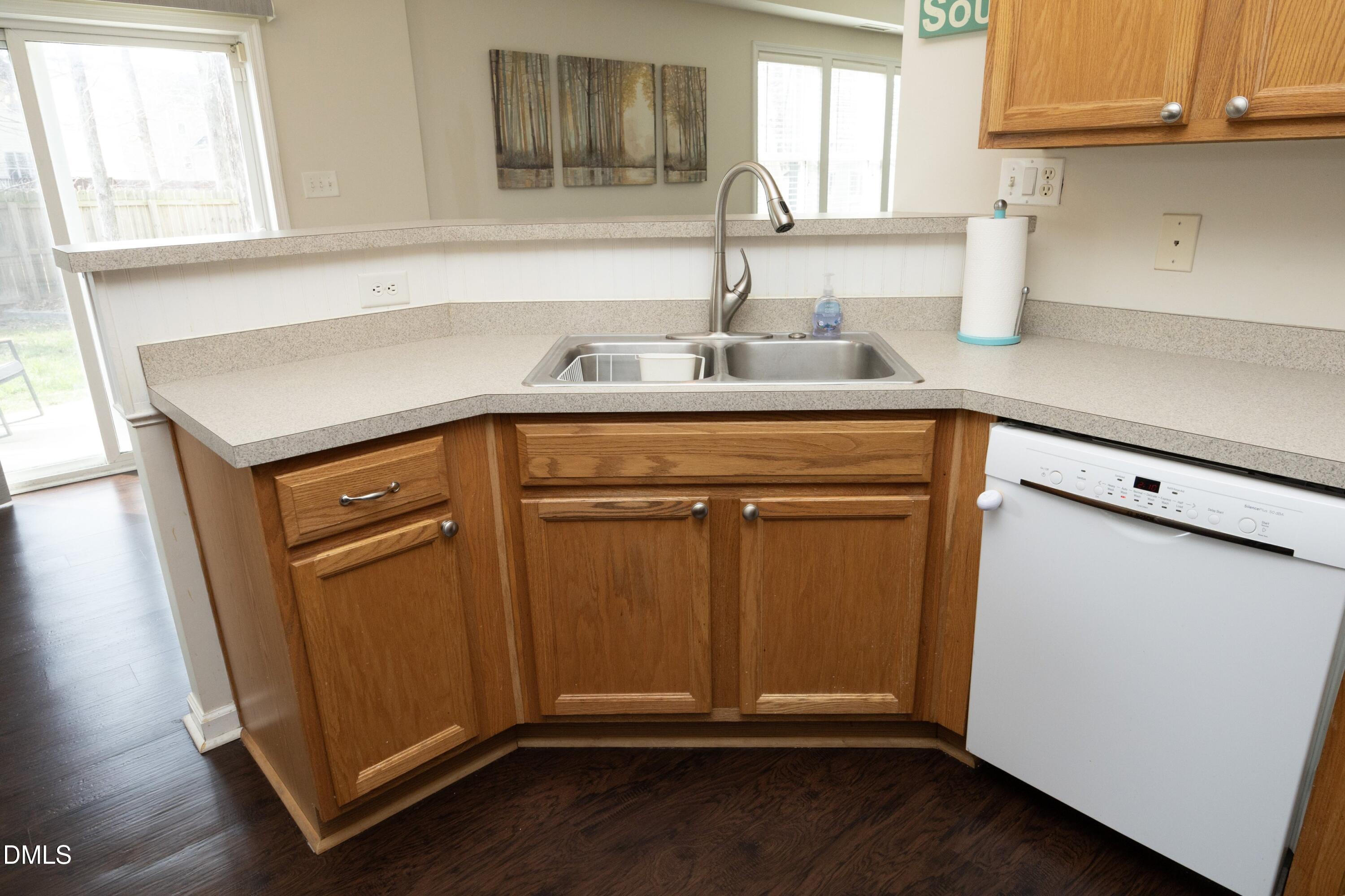 4054 Landover Lane Raleigh, NC 27616 - Photo 13 of 27 a kitchen with granite countertop a sink and cabinets