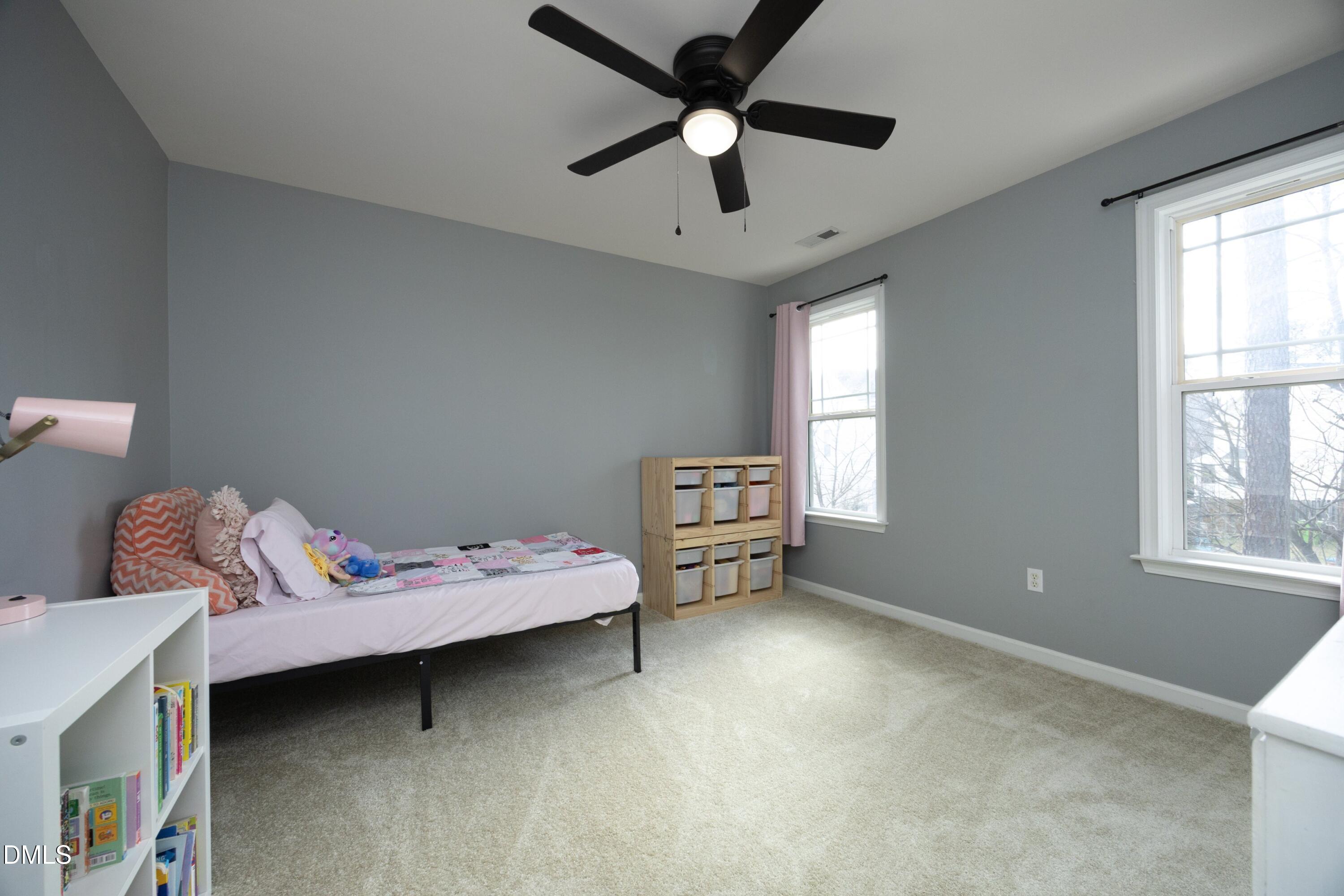 4054 Landover Lane Raleigh, NC 27616 - Photo 18 of 27 a bedroom with bed and window