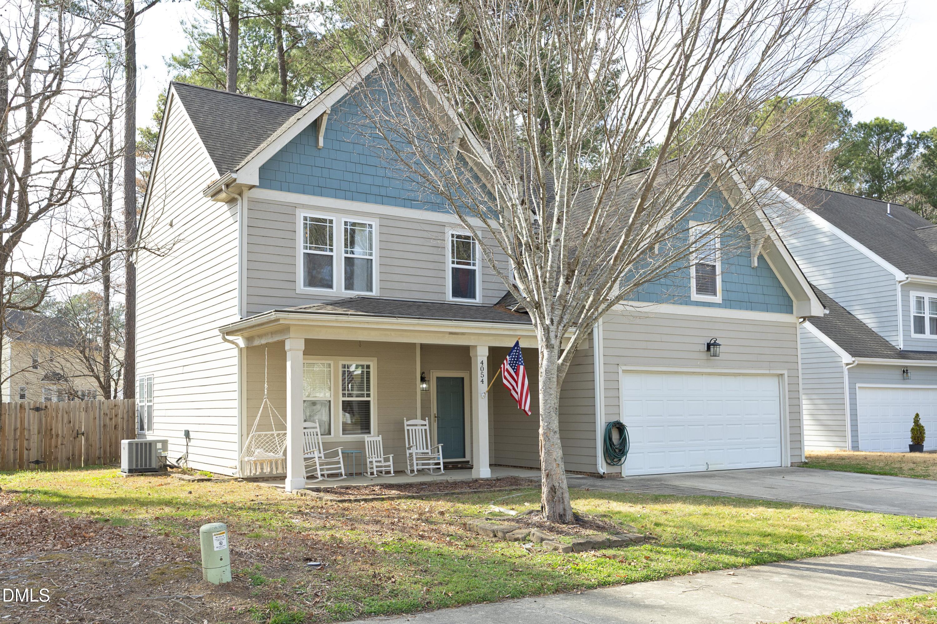 4054 Landover Lane Raleigh, NC 27616 - Photo 2 of 27 a front view of a house with a yard and garage