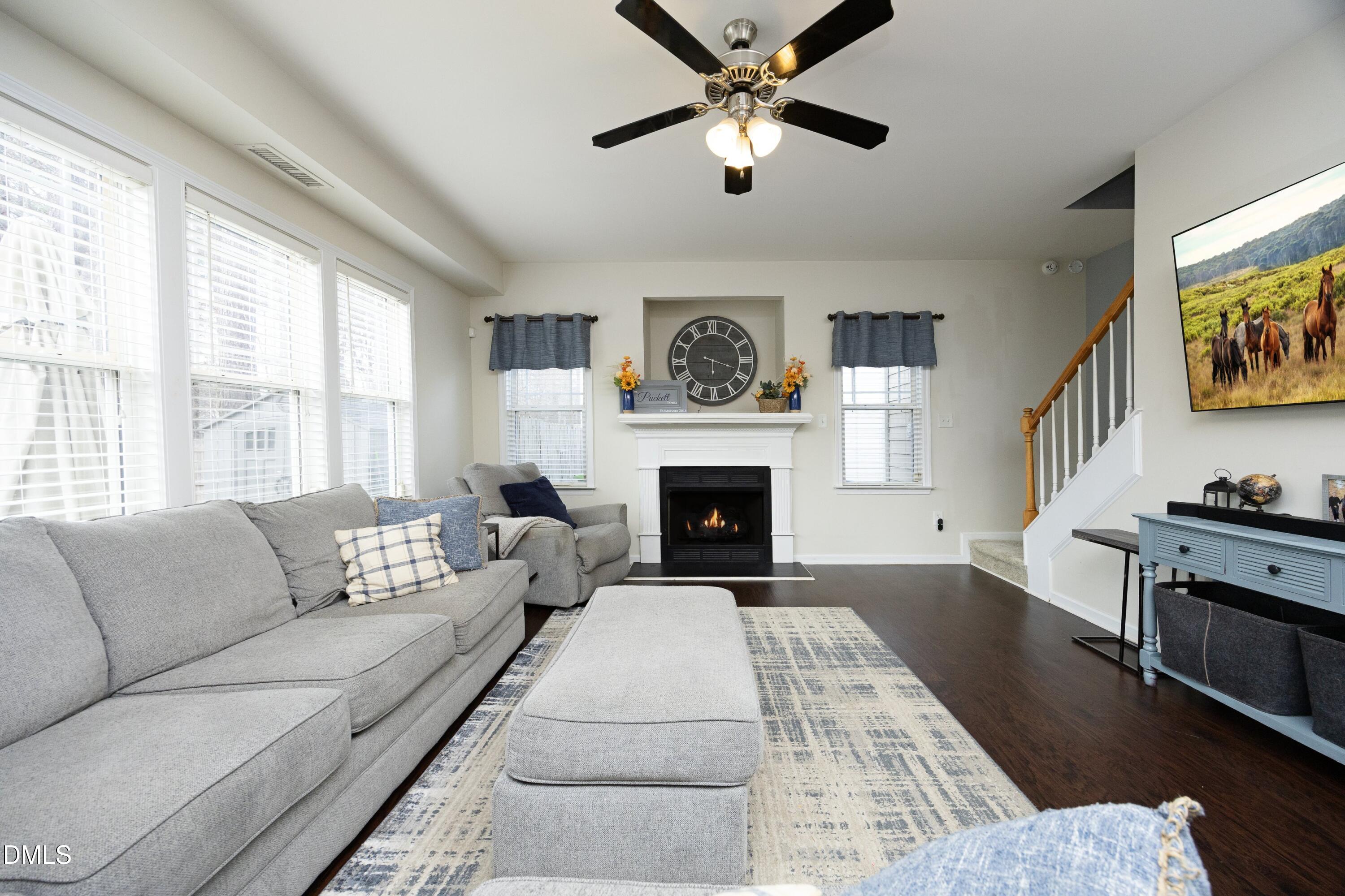 4054 Landover Lane Raleigh, NC 27616 - Photo 6 of 27 a living room with furniture and a fireplace