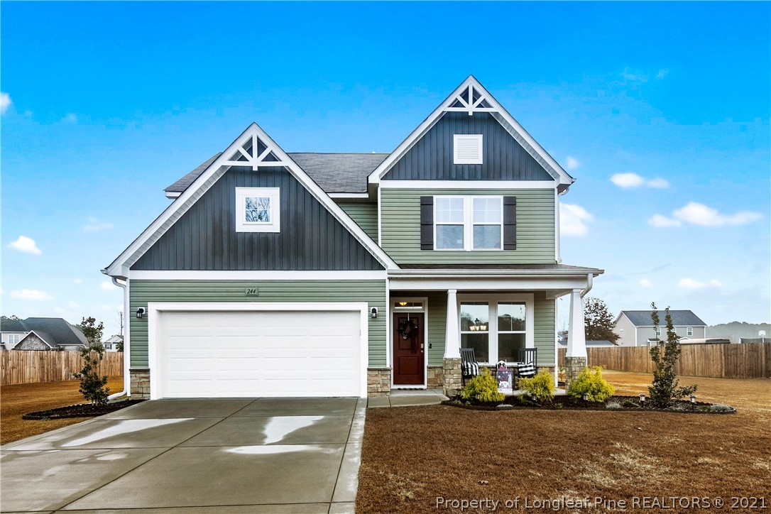 244 Mill Ridge Court Godwin, NC 28344 - Photo 1 of 50 a front view of a house with a yard