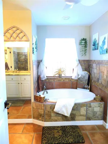 a living room with a couch and a table with wooden floor