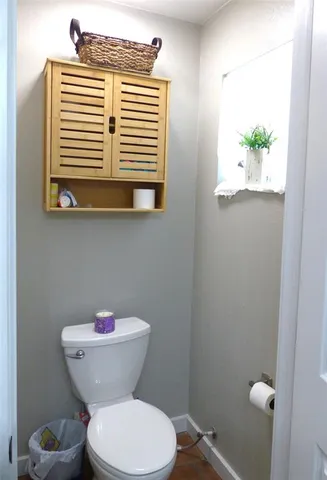a bathroom with a toilet and a sink