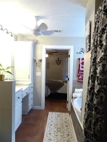 a view of a house with backyard and a tree