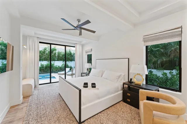 a bathroom with a double vanity sink a mirror and a bathtub