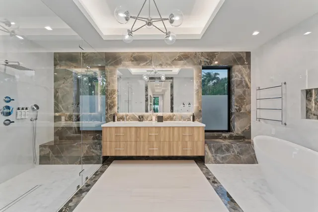 a large white bed in a white room