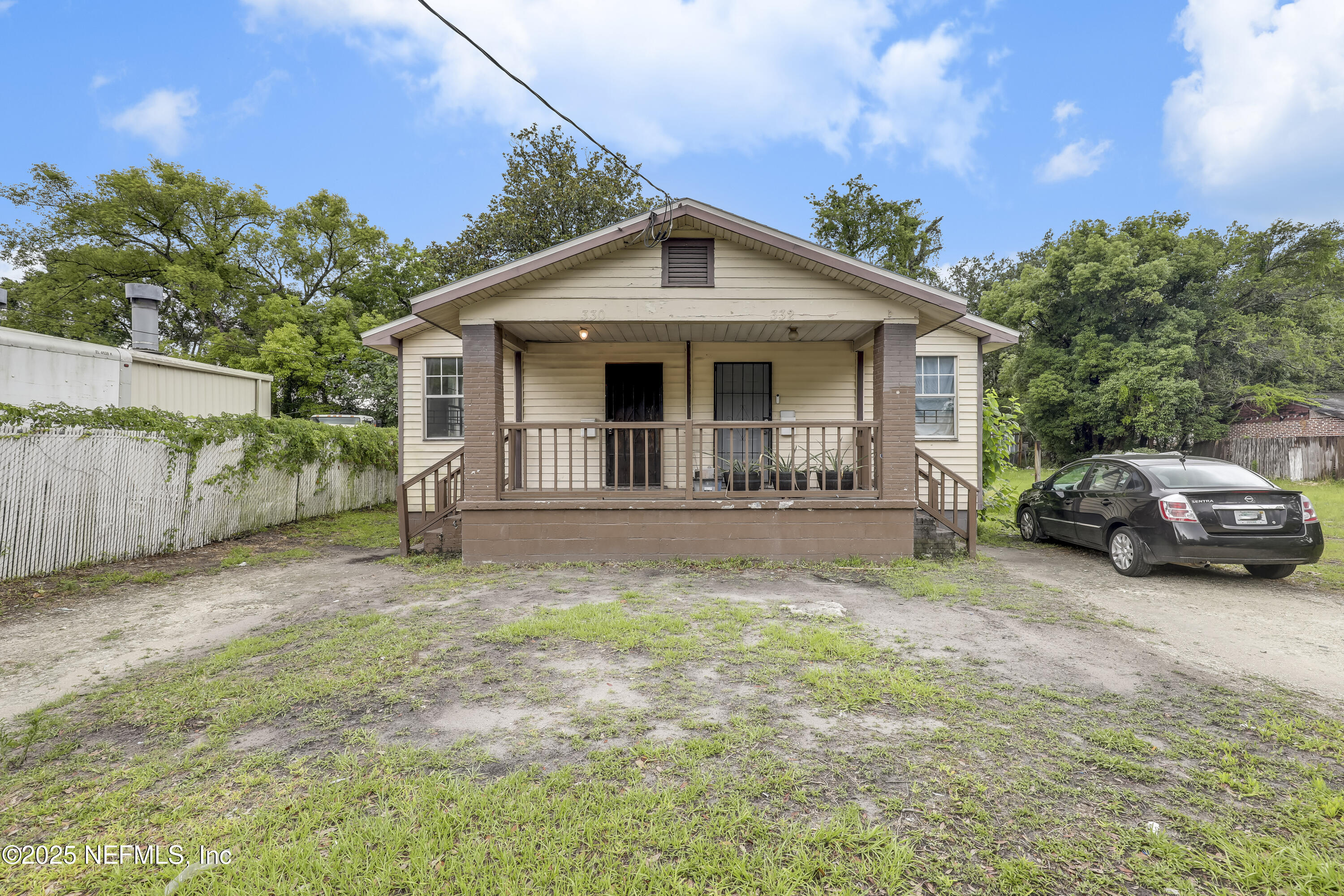 330 West 26th Street Jacksonville, FL 32206 - Photo 26 of 27 a view of a house with a yard and large trees