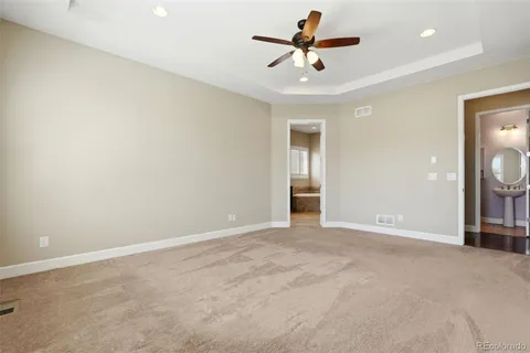 an empty room with a empty space and a ceiling fan