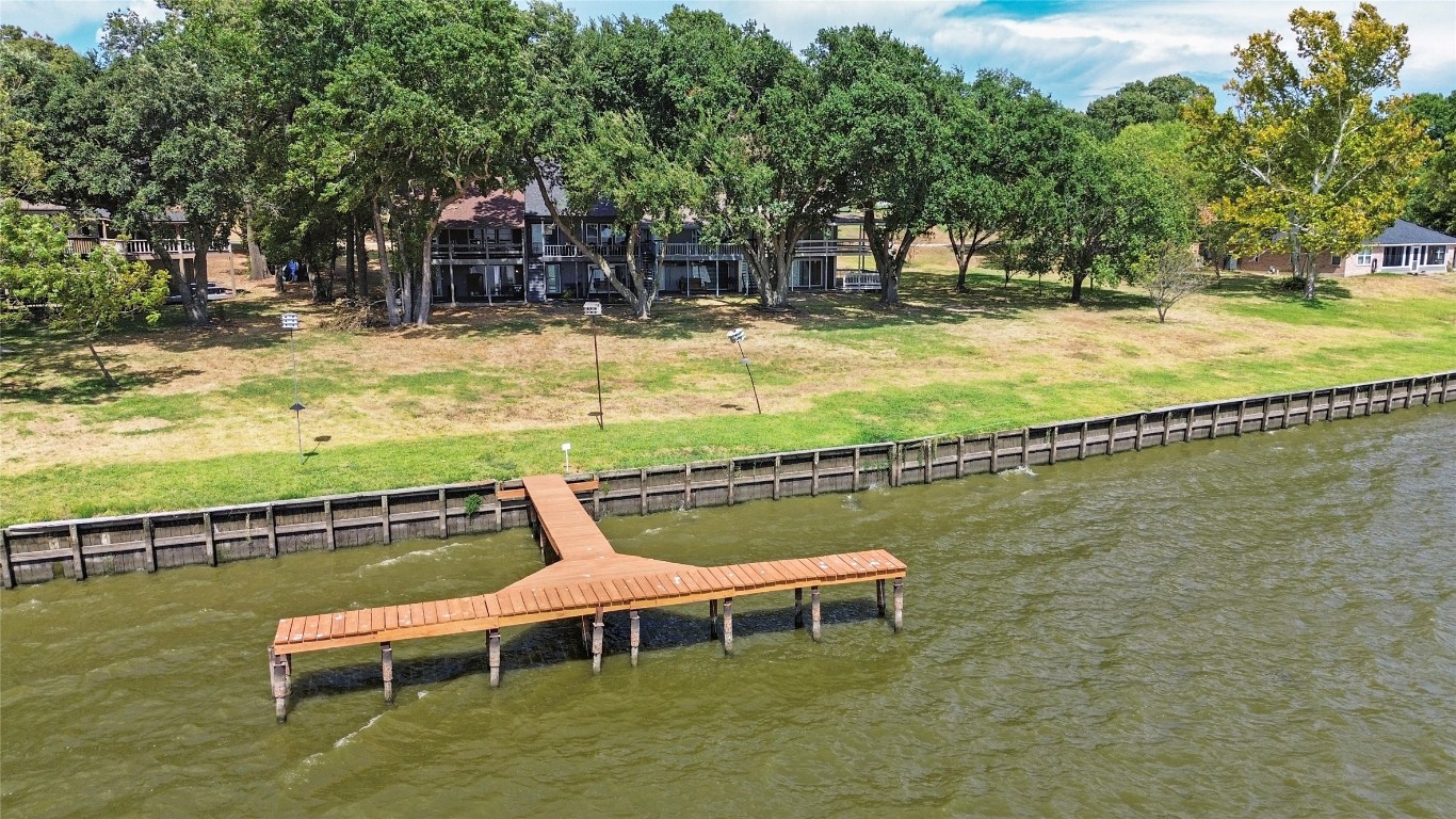 344 Peach Island Trinity, TX 75862 - Photo 15 of 15 a view of a patio with chairs and a table