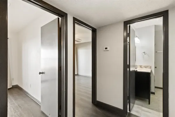 a view of a bathroom from a hallway