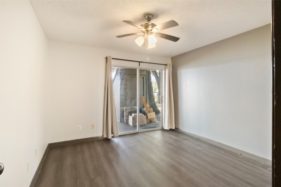 344 Peach Island Trinity, TX 75862 - Photo 9 of 15 an empty room with wooden floor and windows