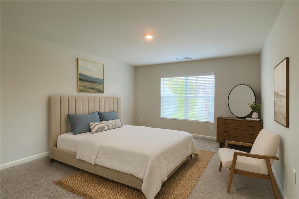 2715 Piper Drive Atlanta, GA 30331 - Photo 11 of 21 a bedroom with a bed a chair and a window