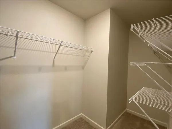 a view of a room with racks on the wall