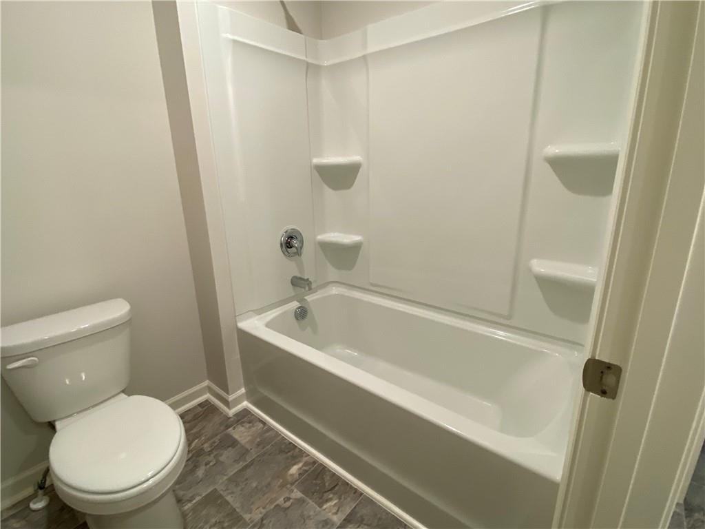 2715 Piper Drive Atlanta, GA 30331 - Photo 17 of 21 a white toilet sitting next to a bath tub