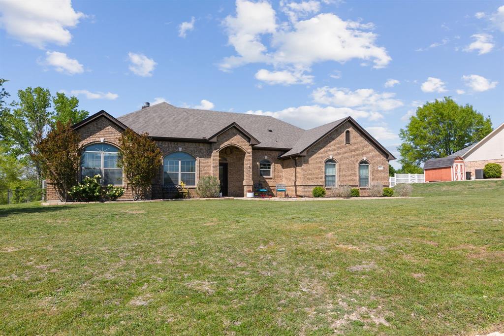1121 Mt Lane Rhome, TX 76078 - Photo 1 of 1 a view of house with garden