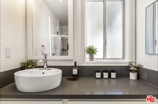 a bathroom with a bathtub and a sink