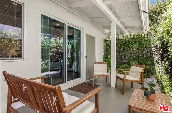 a outdoor living space with furniture and garden view