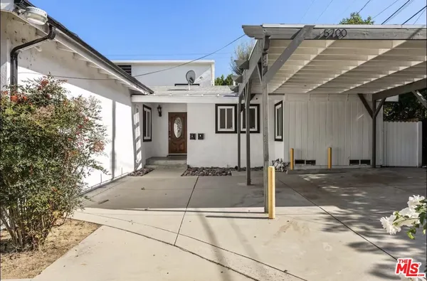 a view of a house with a street