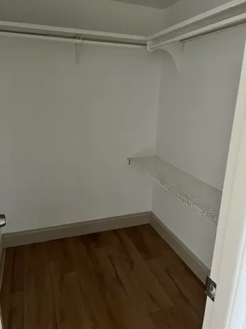 a view of a room with shelf on the wall