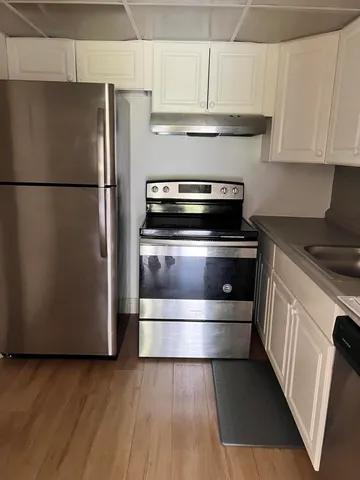 a kitchen with appliances and cabinets