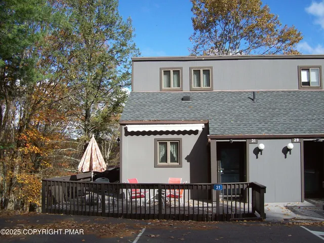 a view of a house with iron fence