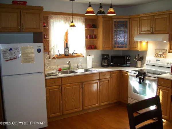 a kitchen with sink cabinets and window