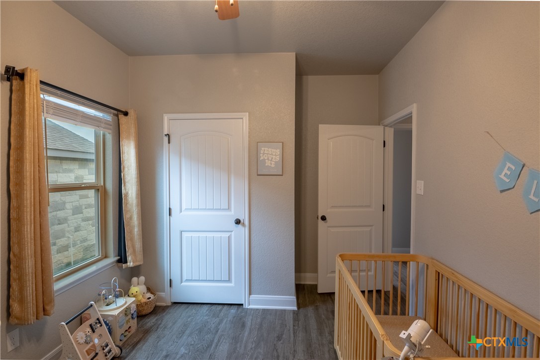 7909 McCulloch Road Temple, TX 76502 - Photo 7 of 46 a view of a hallway with wooden floor and closet
