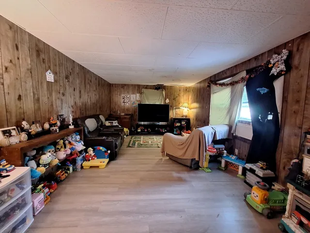 a living room with lots of furniture and a flat screen tv