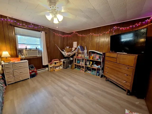 a room with furniture and a flat screen tv