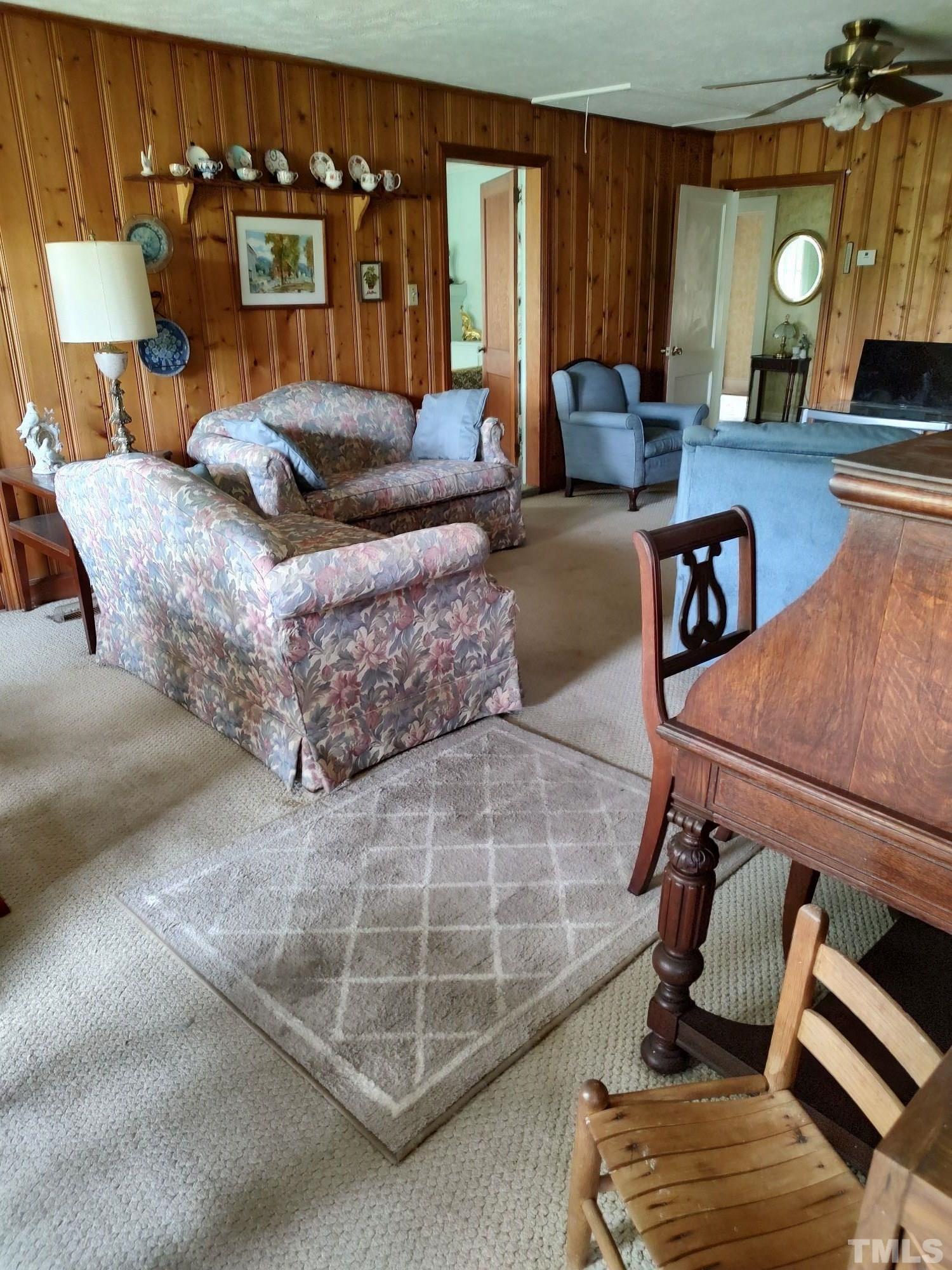 8727 Peacock Road Whiteville, NC 28472 - Photo 15 of 25 a living room with furniture and a fireplace