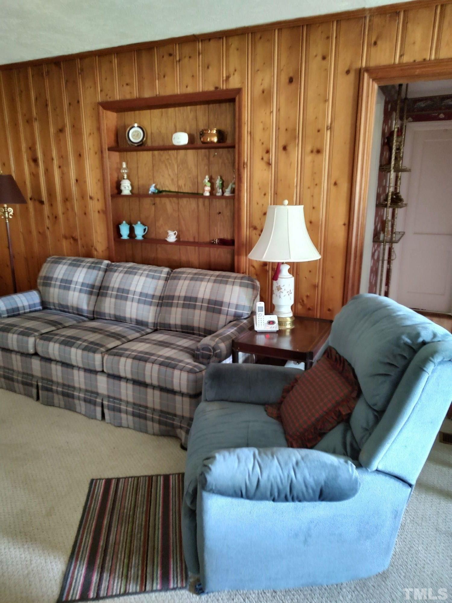 8727 Peacock Road Whiteville, NC 28472 - Photo 18 of 25 a living room with furniture and a fireplace