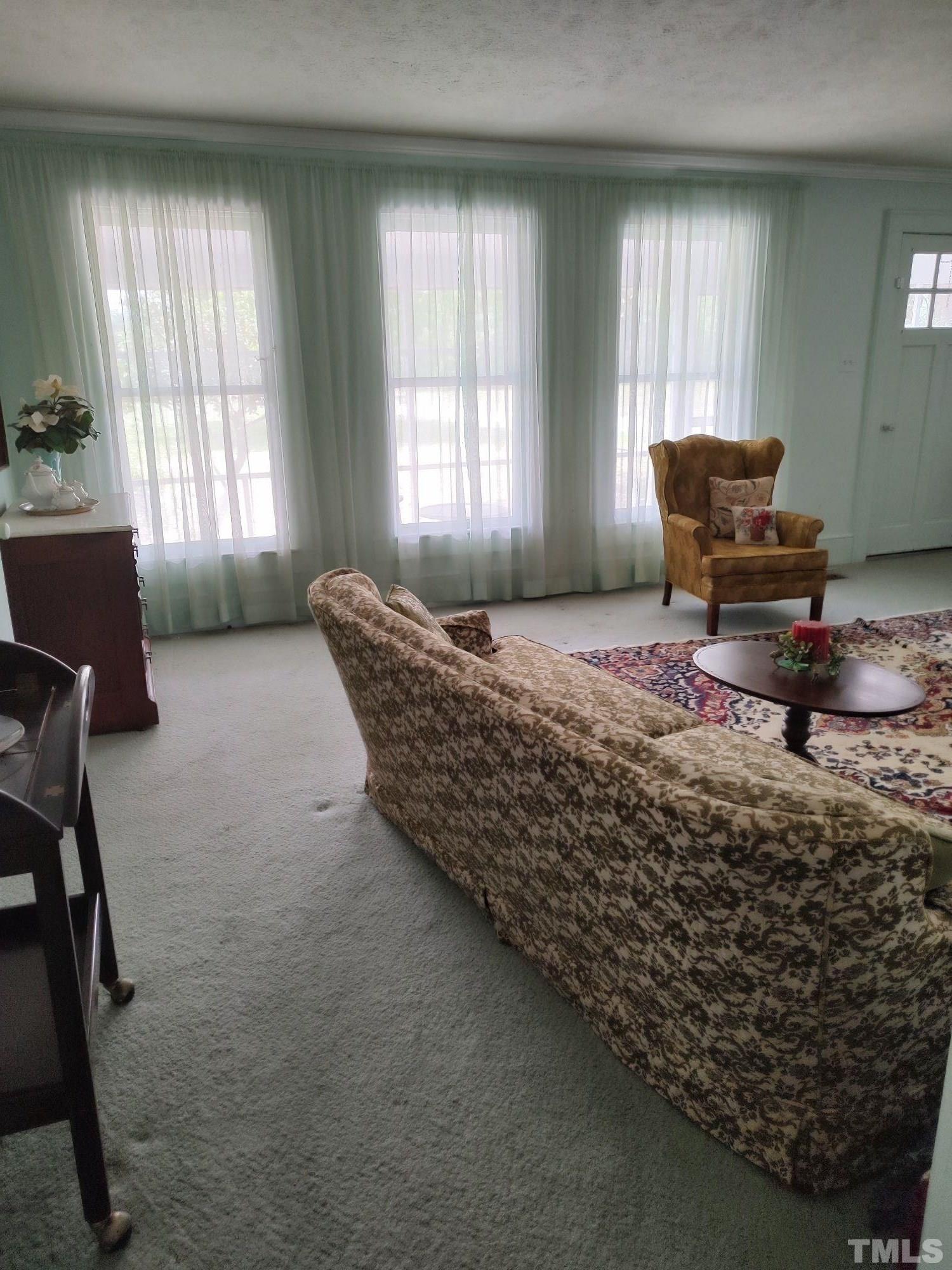 8727 Peacock Road Whiteville, NC 28472 - Photo 20 of 25 a bed sitting in a room next to a window