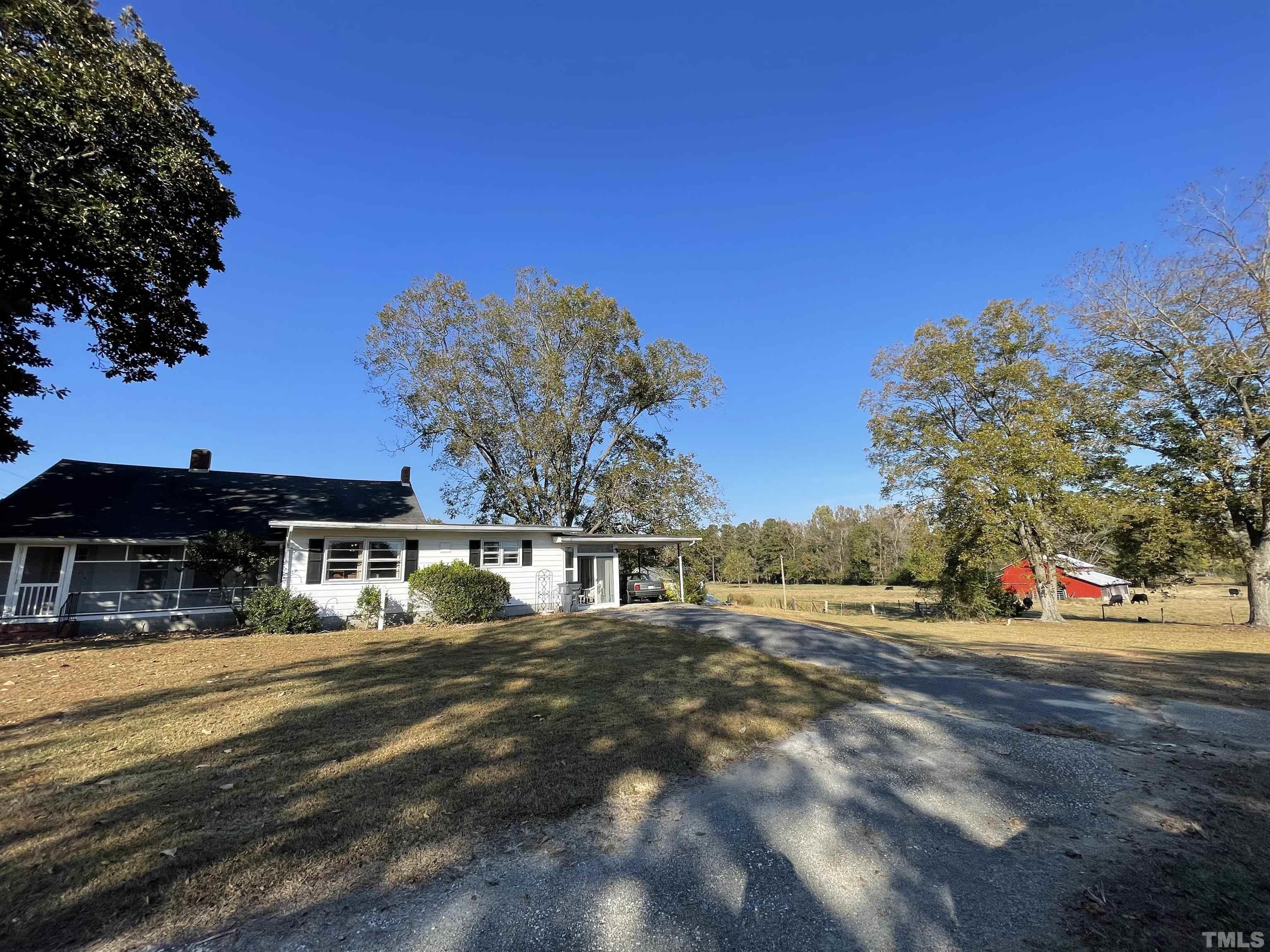8727 Peacock Road Whiteville, NC 28472 - Photo 3 of 25 a view of a house with a big yard