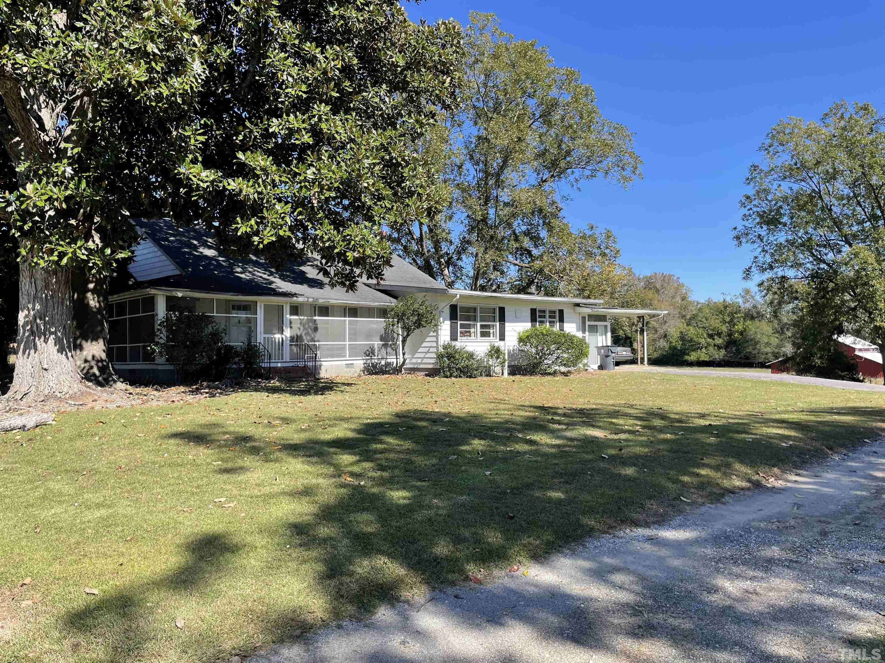 8727 Peacock Road Whiteville, NC 28472 - Photo 4 of 25 a view of house with outdoor space and garden