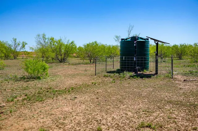 a view of a yard covered with snow in outdoor space