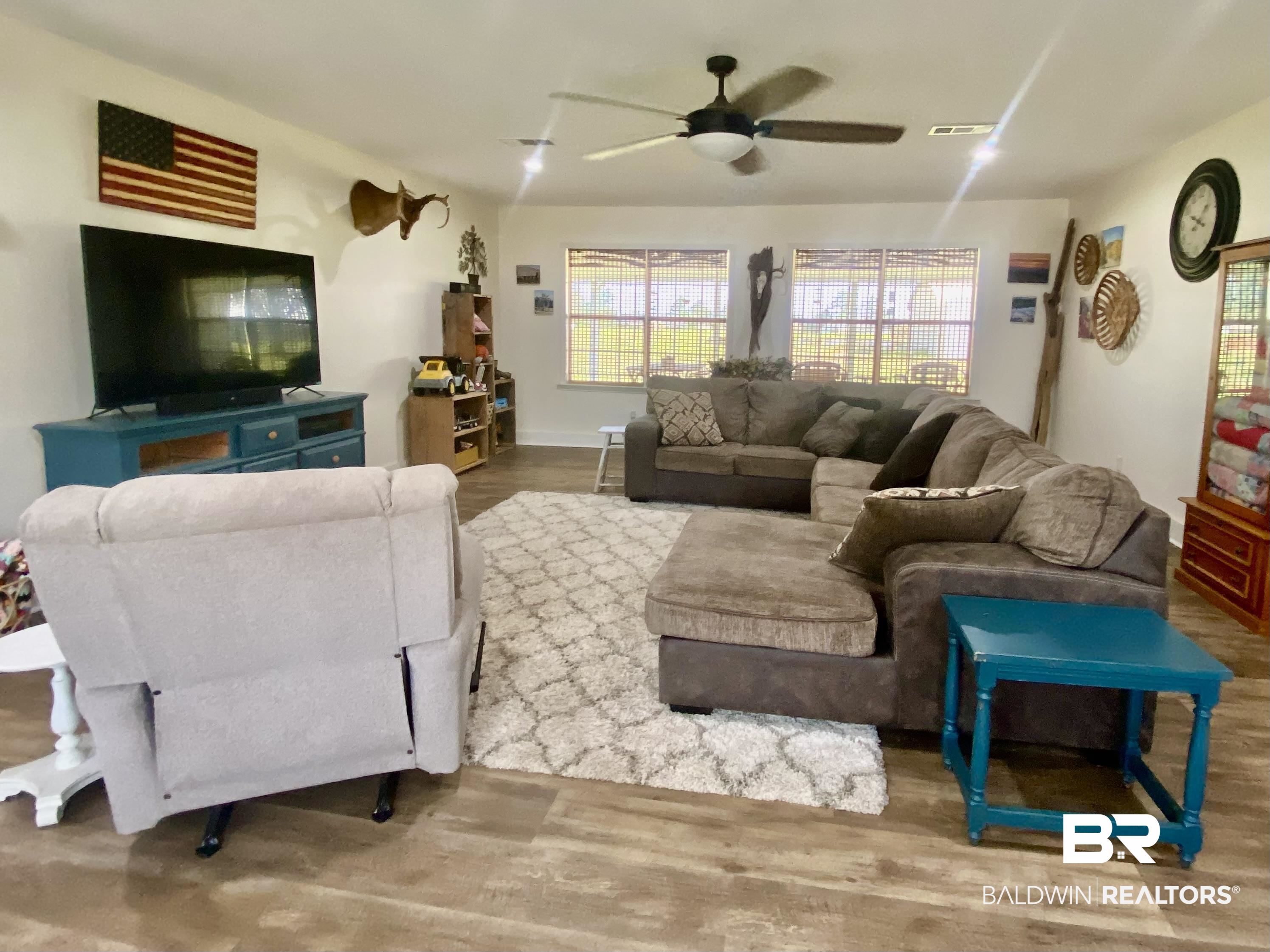 531 Highway 136 Monroeville, AL 36460 - Photo 6 of 48 Living room featuring hardwood / wood-style flooring and ceiling fan