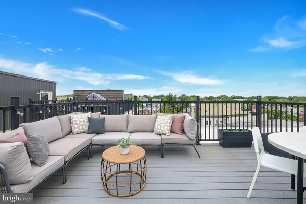 a balcony with furniture and city view