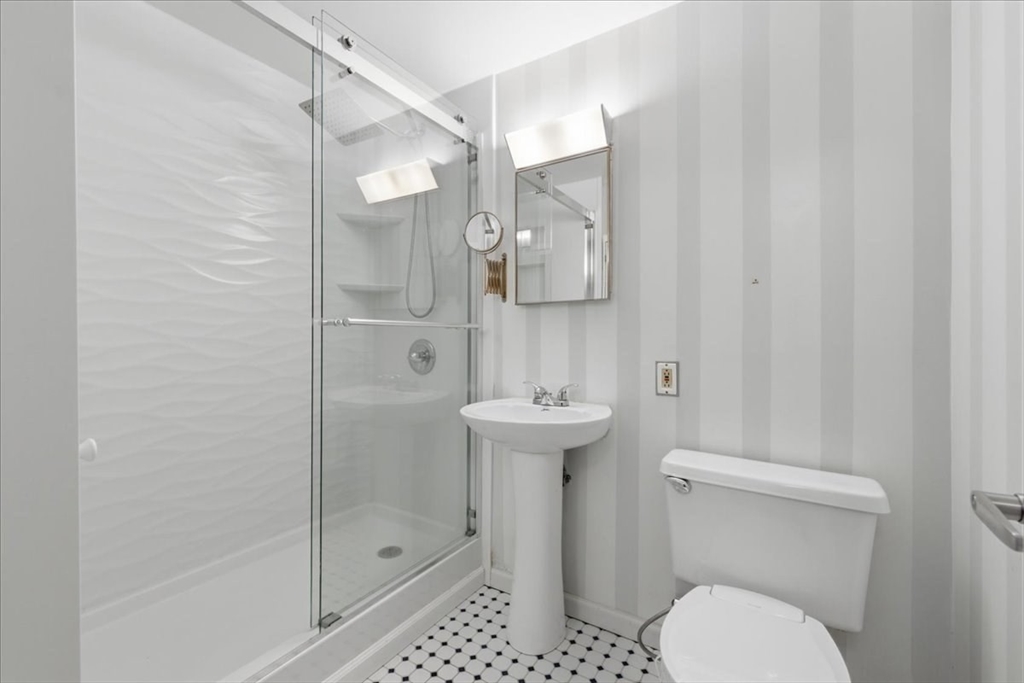 7A Eugene Circle, Unit B Boston, MA 02130 - Photo 16 of 42 a bathroom with a shower a toilet and sink