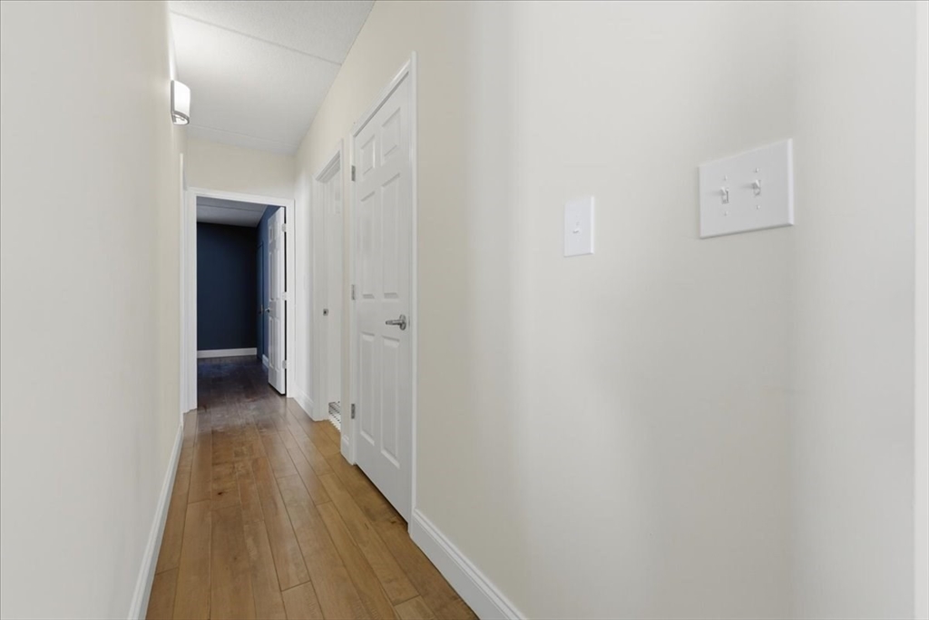 7A Eugene Circle, Unit B Boston, MA 02130 - Photo 17 of 42 a view of a hallway with wooden floor