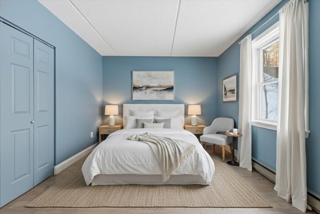7A Eugene Circle, Unit B Boston, MA 02130 - Photo 18 of 42 a bedroom with a bed and a window